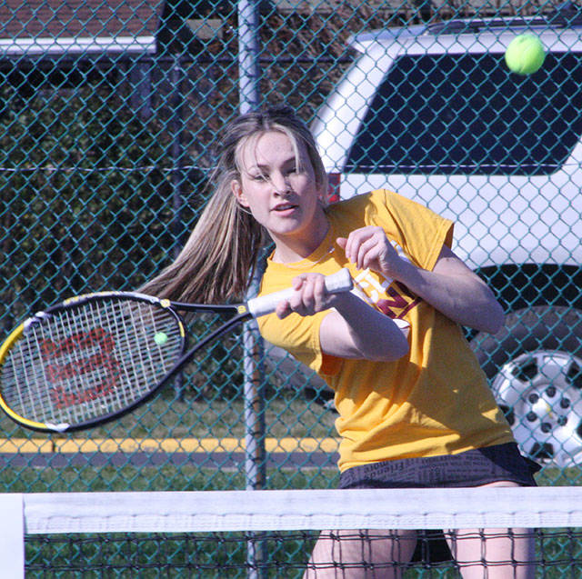 Enumclaw High’s Emily Miller returns a serve during tennis action March 20 at EHS. Miller and partner Camryn Hayett, playing at No. 1 doubles, blanked their foes from Thomas Jefferson High 6-0, 6-0. It was a good day for the Hornet squad, which registered a 5-0 victory over their NPSL rival. Photo by Kevin Hanson