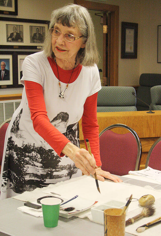 Artist Darlene Dihel explained the art of sumi painting and gave a demonstration during an open house April 6 in Gallery 2018. KEVIN HANSON PHOTO