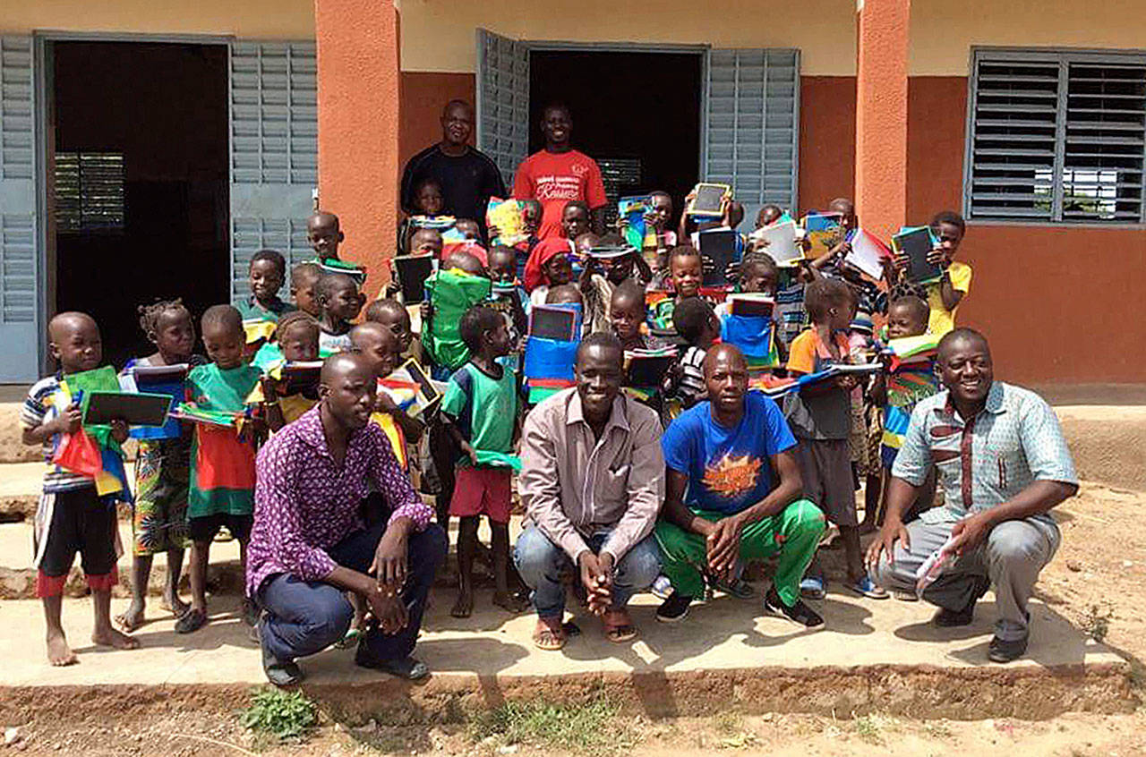 WITLI Village Director Adama Ouedraogo, center, with students and staff of Rialo Evangelic, the one school in the village. Submitted photo
