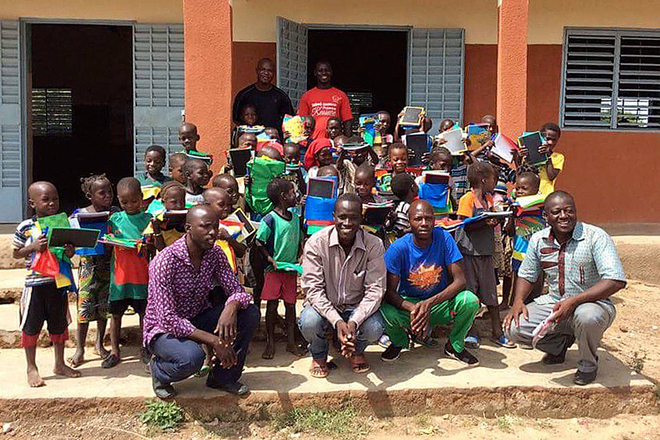 WITLI Village Director Adama Ouedraogo, center, with students and staff of Rialo Evangelic, the one school in the village. Submitted photo