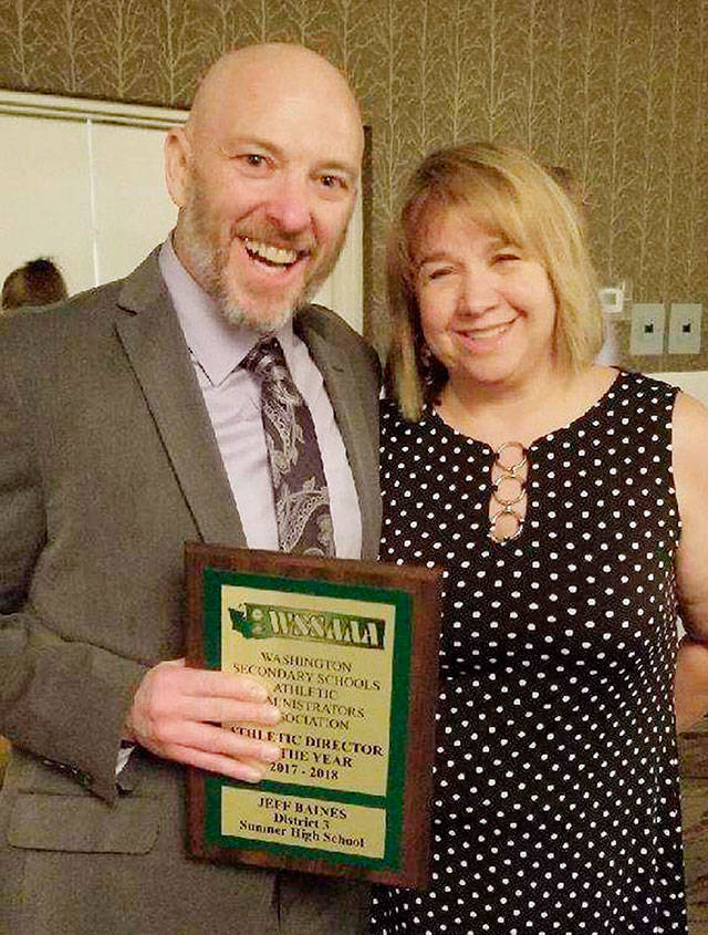 Sumner High’s Jeff Baines was joined by his wife, Marguerite, after accepting the state’s Athletic Director of the Year Award. Submitted photo