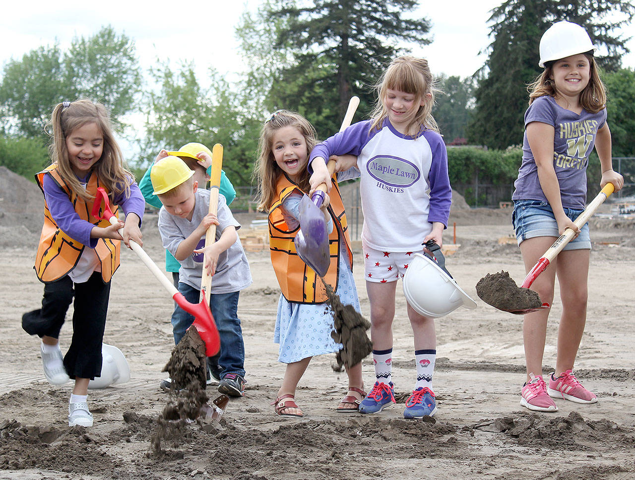 Students from Maple Lawn and Daffodil Valley elementary schools started the groundbreaking event with a song called “Mr. Sun,” and participated in breaking ground. Photo by Ray Miller-Still