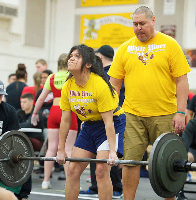 With coach Juan Garibay looking on, White River powerlifter Tatiana Molinero-Ceras competes in the dead lift during the state meet. SUBMITTED PHOTO