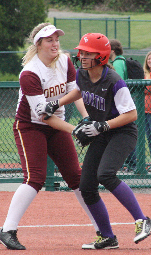 White Rivers Payton Wallen applies a tag at third base, shutting down a North Kitsap scoring opportunity during Fridays district softball game. Photo by Kevin Hanson