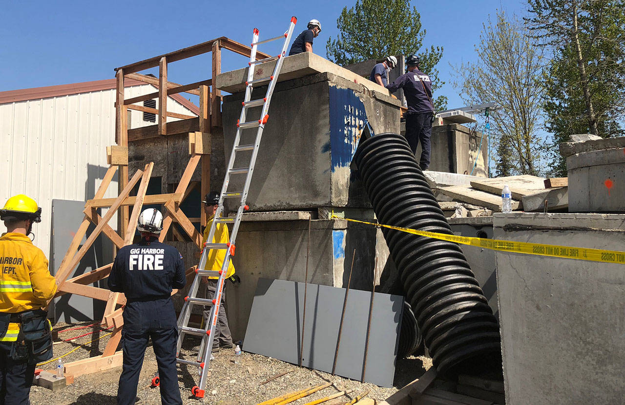 Members of East Pierce Fire & Rescue, in addition to the PCSORT train on the materials donated by Oldcastle Precast. Submitted photo