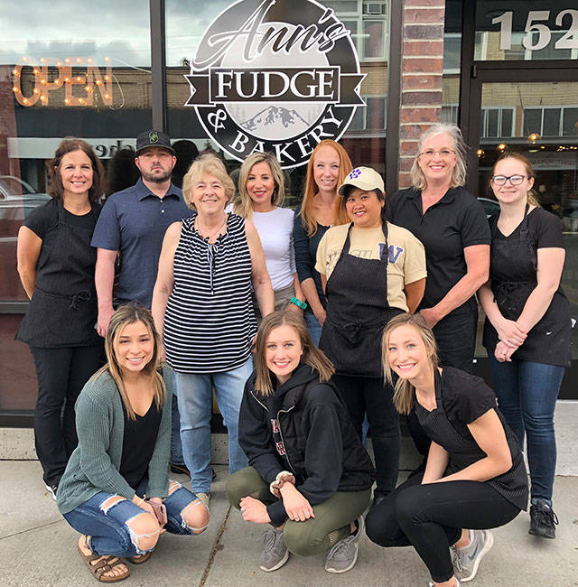The crew at Ann’s Fudge gathered for a photo in front of the Cole Street shop. Owner Ann Smith is in stripes. Submitted photo
