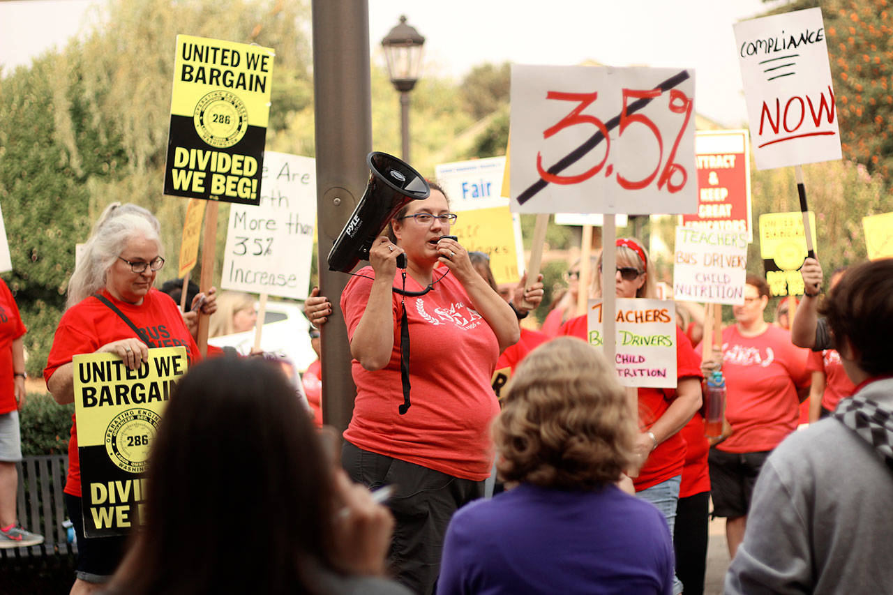 Gabrielle Wright, president of the Sumner Education Association and english teacher at Bonney Lake High School, led a picket group of teachers, bus drivers and nutrition workers who are demanding the Sumner-Bonney Lake School District give them large percentage wage increases, or face a strike. Photo by Ray Miller-Still