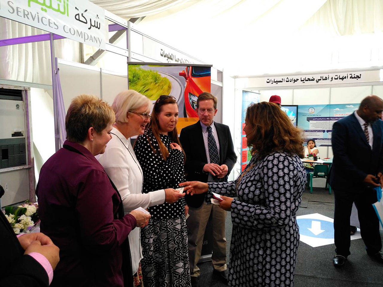 Sheryl Vanderwalker, in white, and her Global Driving Solutions group meeting Rachna Korhonen, the U.S. Conculate General to Saudi Arabia at the Imam Abdulrahman Bin Faisal University driving forum for women. Photo courtesy Sheryl Vanderwalker.