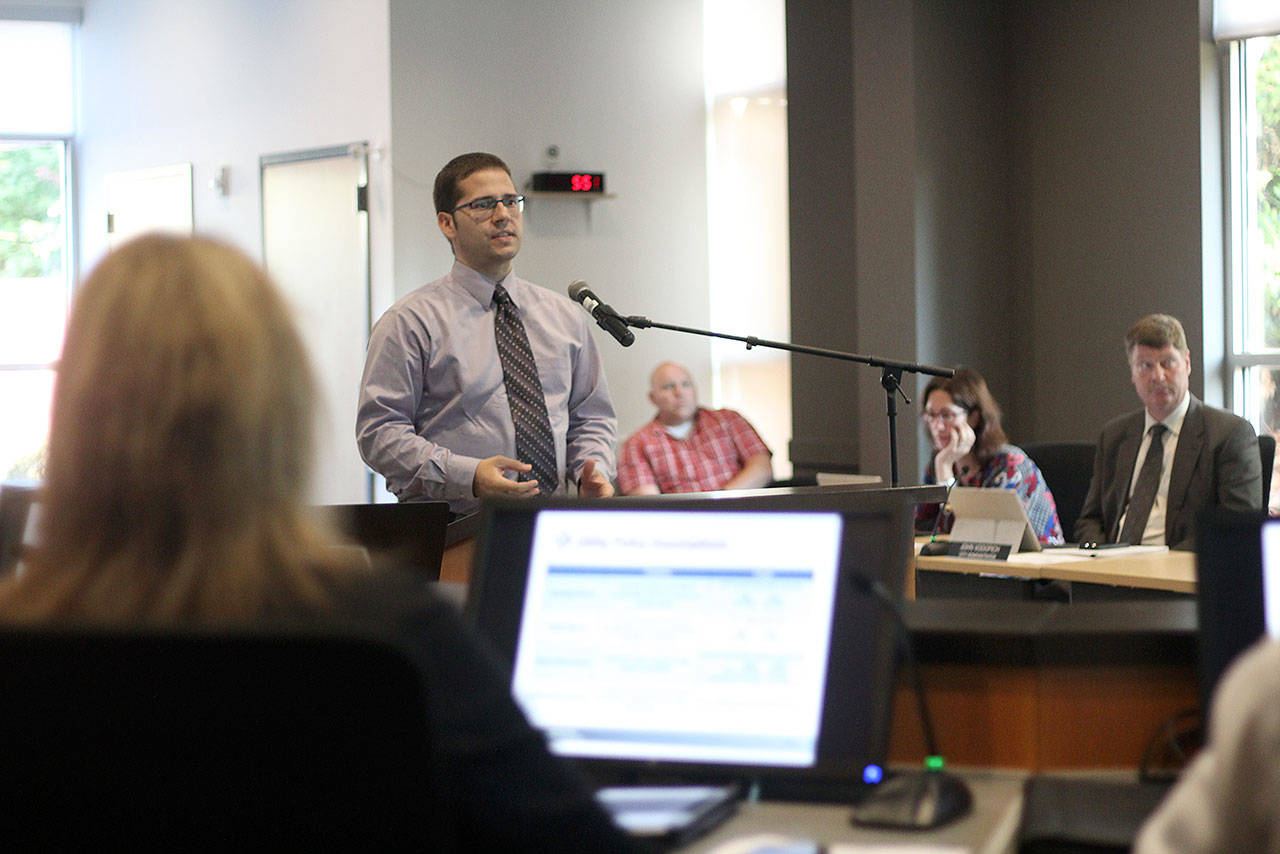 Chris Gonzales of the Financial Consulting Services Group recently proposed multi-year increases to Bonney Lakes water and sewer utility rates. If passed by the city council, the average monthly bill could be around $35 more expensive by 2023. Photo by Ray Miller-Still