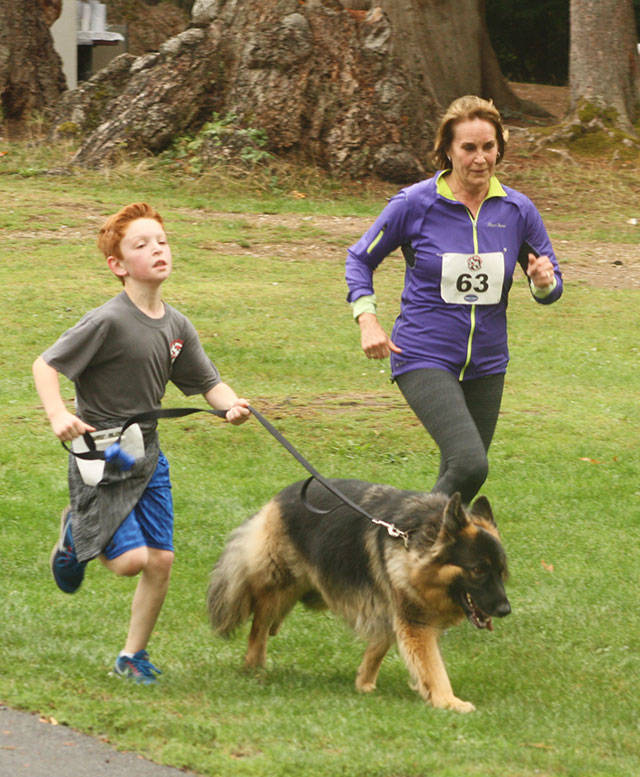 Participants are encouraged to run with their four-legged companions during the annual Tails ‘n’ Trails event at Lake Wilderness Park. This year’s fun run is slated for Sept. 29. FILE PHOTO BY KEVIN HANSON