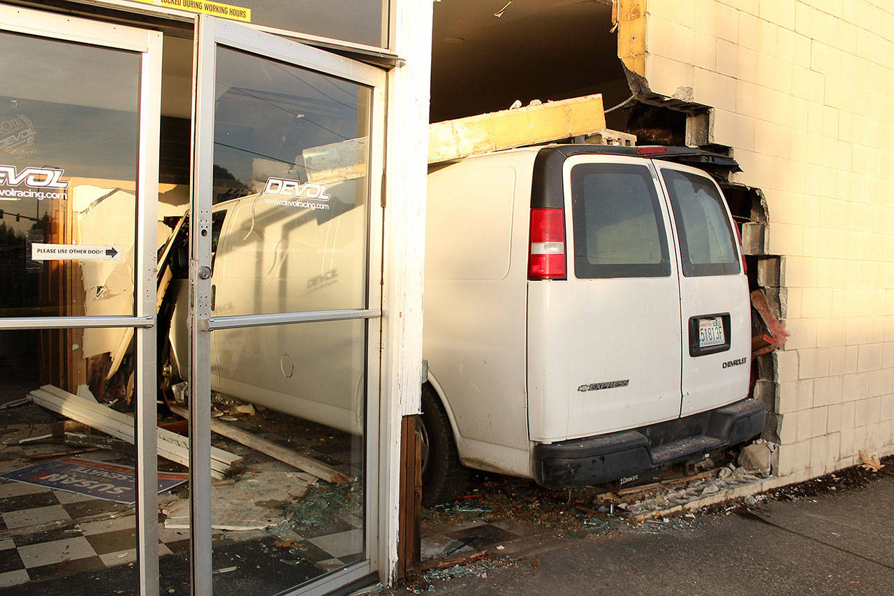 According to the Enumclaw Police Department, it appears the accelerator got stuck on this van before it went through the wall of DeVol Racing Equipment.                                According to the Enumclaw Police Department, the van’s accelerator got stuck somehow, causing the wreck. A more thorough investigation is expected now that the van has been removed from the building. Photo by Ray Miller-Still