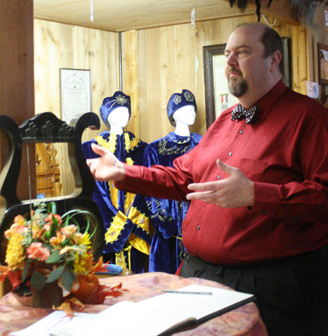Tody Hanson, grand master of Washington’s Odd Fellows and a member of the Buckley lodge, shows one of the displays in the local museum. Most of the items are from lodges that have disbanded, like the banner from tiny Dixie, Washington. PHOTOS BY KEVIN HANSON