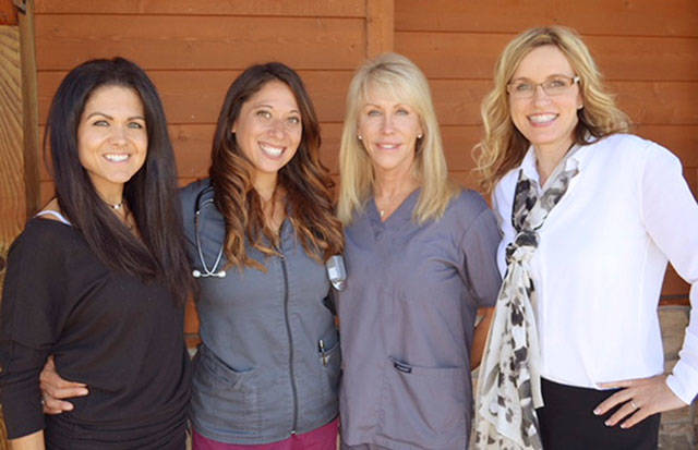 The staff at Rainier Laser and Aesthetics Center includes, from left, April Gallagher, Kelsey Isbell, Debbie Melby and Dr. Holly Dickson.