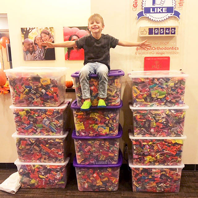 Sawyer Molen sitting on top of the haul of candy Molen collected in Auburn. Photo courtesy Misty Kissack.