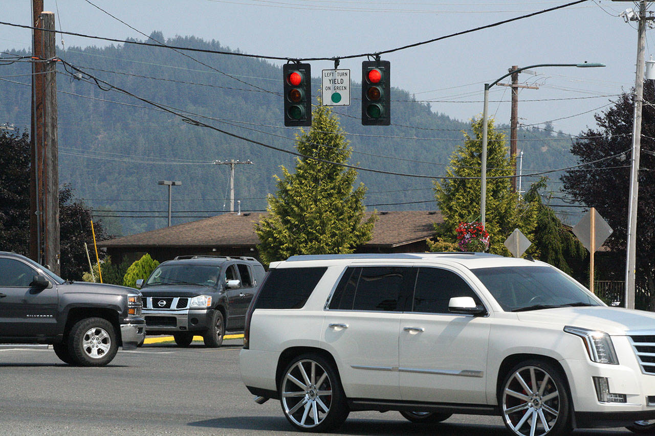The replacement of three traffic lights in Buckley, including this one at SR 410 and Park Avenue, has been delayed. The state says they should be installed in February. Photo by Kevin Hanson