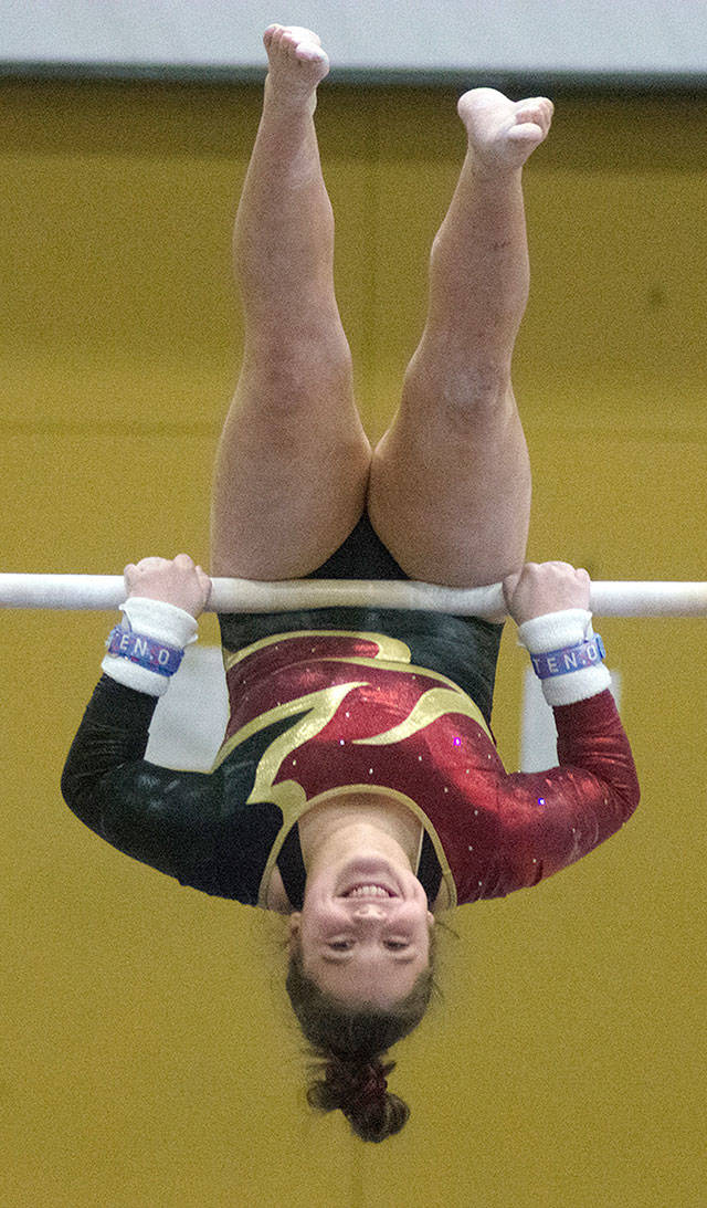 Emelia Oliver works the bars during last week’s meet at Decatur High. Photo by Kayse Angel