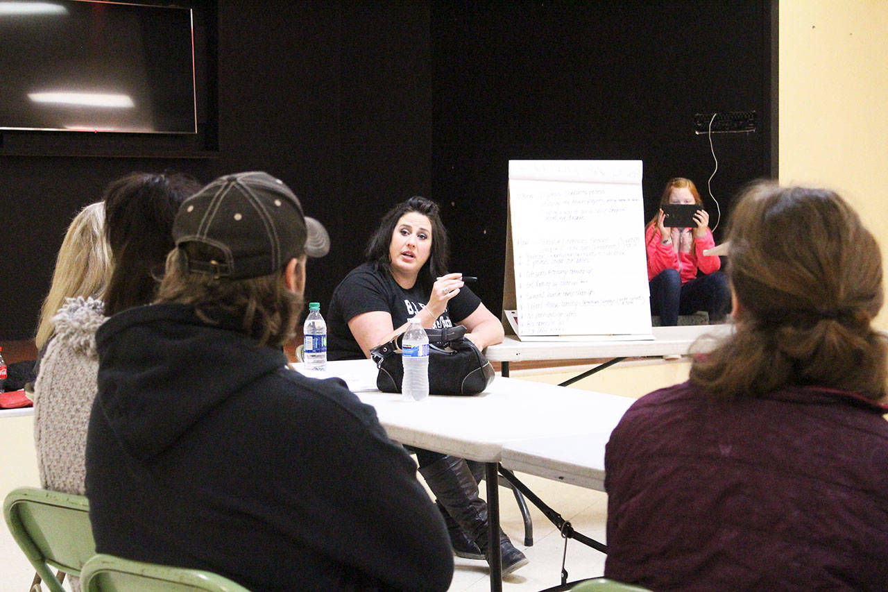 Bonney Lake Buckley Against Drugs had its first official group meeting Saturday, Feb. 2, at the Prairie Ridge Recreation Hall. Rhiannon Geffre, center, talked about how the group was started, what the group has accomplished so far — including needle clean-ups both around Bonney Lake businesses and in homeless camps, as well as lobbying the city of Bonney Lake to pass an anti-panhandling ordinance — and answered questions from the roughly 20 people who attended. Photo by Ray Miller-Still