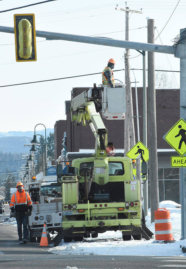 Crews were installing new traffic lights at three Buckley intersections last week, including this one at SR 410 and Main Street. Photo by Kevin Hanson