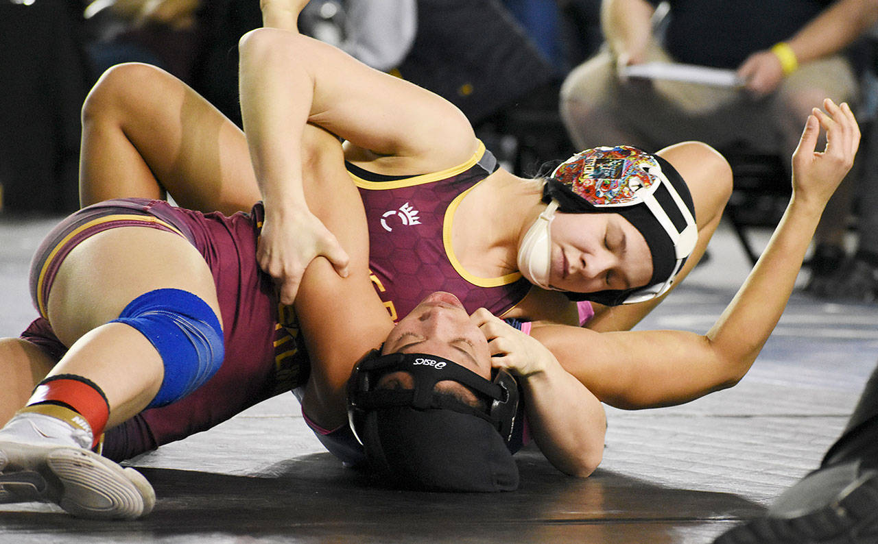 Payton Stroud was one of the several White River wrestlers who took the championship title in the latest Mat Classic. Pictured below the article are Weston Lyver, Jack Ervien, Claire DiCugno, and Bonney Lake wrestler Yusief Lillie, who also claimed a title. Photos by Kevin Hanson