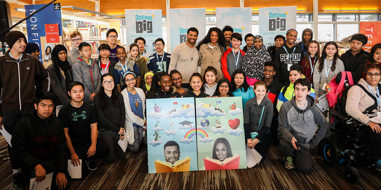 The Why Not You Foundation is bringing a new KCLS program, Teen Voices, to six KCLS libraries, including Enumclaw. Pictured is Russell WIlson and Ciara pose with the students from Foster High School at the conclusion of last Friday’s event. Courtesy photo Why Not You Foundation.