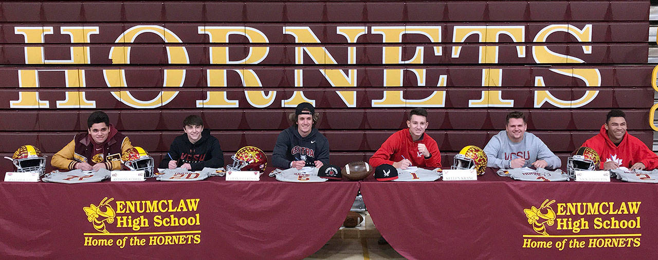 Signing a national Letter-of-Intent at Enumclaw High were, from left, Mathew Utu, Anthony Russell, Ethan Eilertson, Kellen Kranc, Nick Harberts and Darrion Smith.