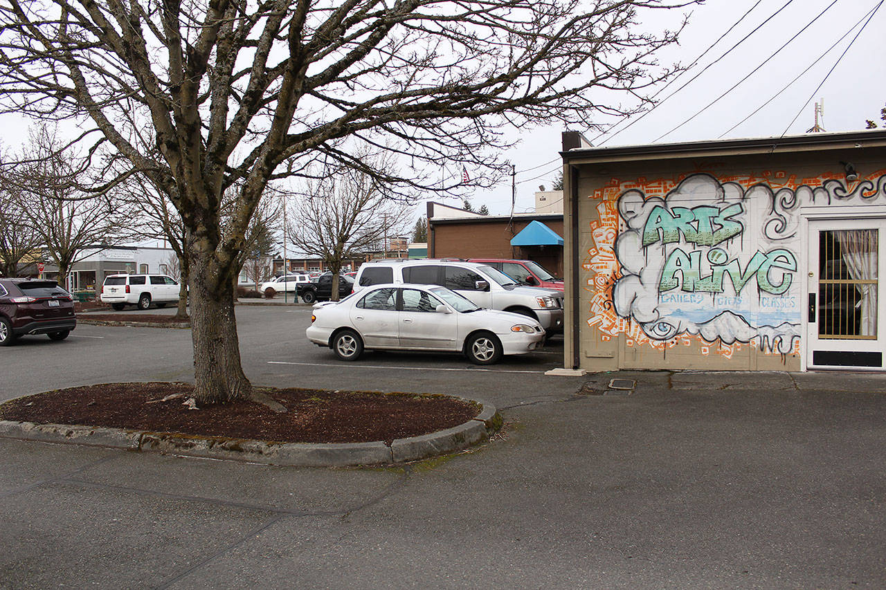 The Enumclaw City Council has now heard two proposals for developing the under-utilized parking lot behind the Chamber of Commerce and Arts Alive! buildings. Photo by Ray Miller-Still