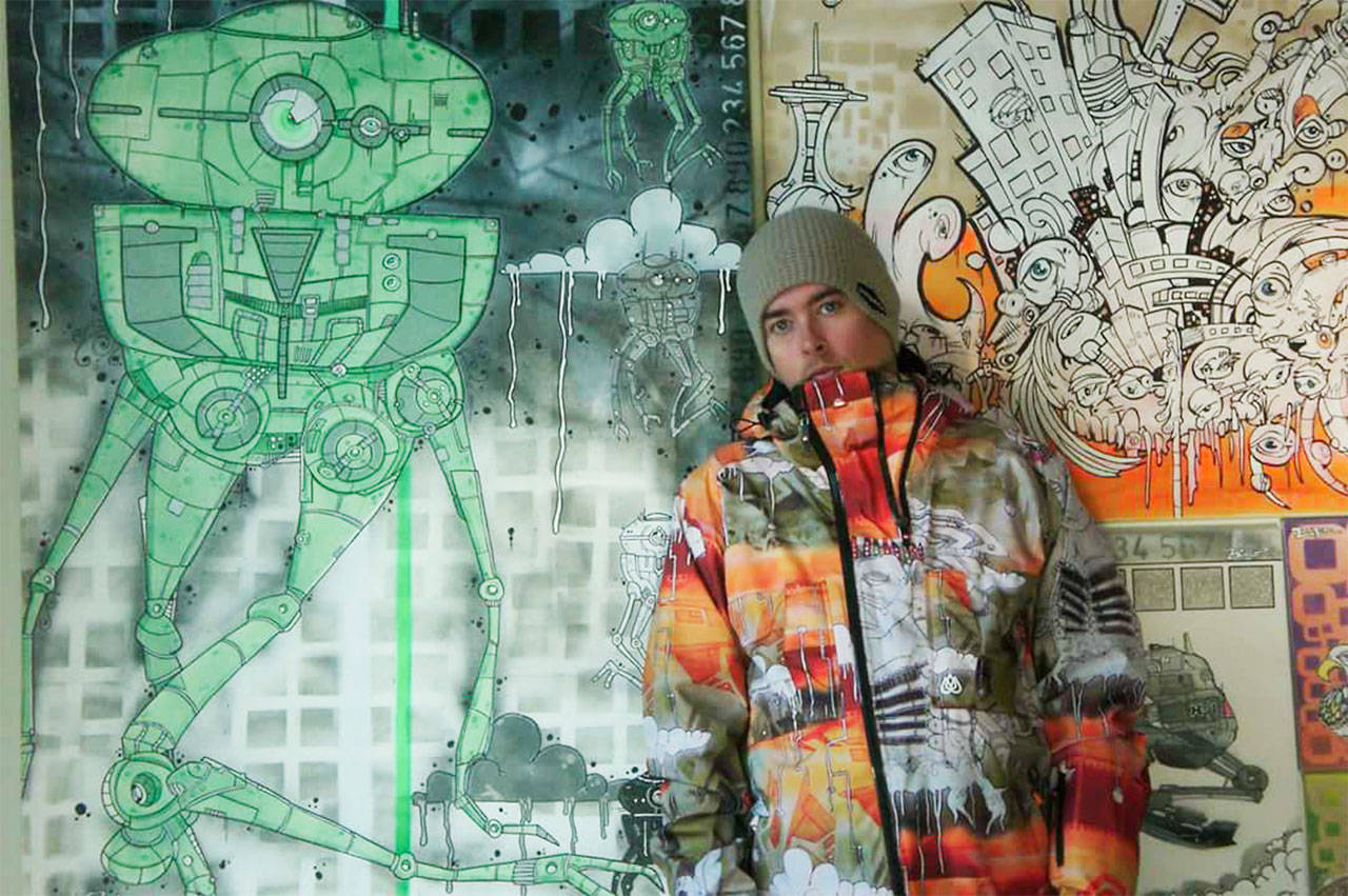 Benji Pierson wears the jacket he designed for famed snowboarder Travis Rice, who wore it in his film, “Art of FLIGHT.” The film is showing at the Chalet Theater on March 27 at 7 p.m.