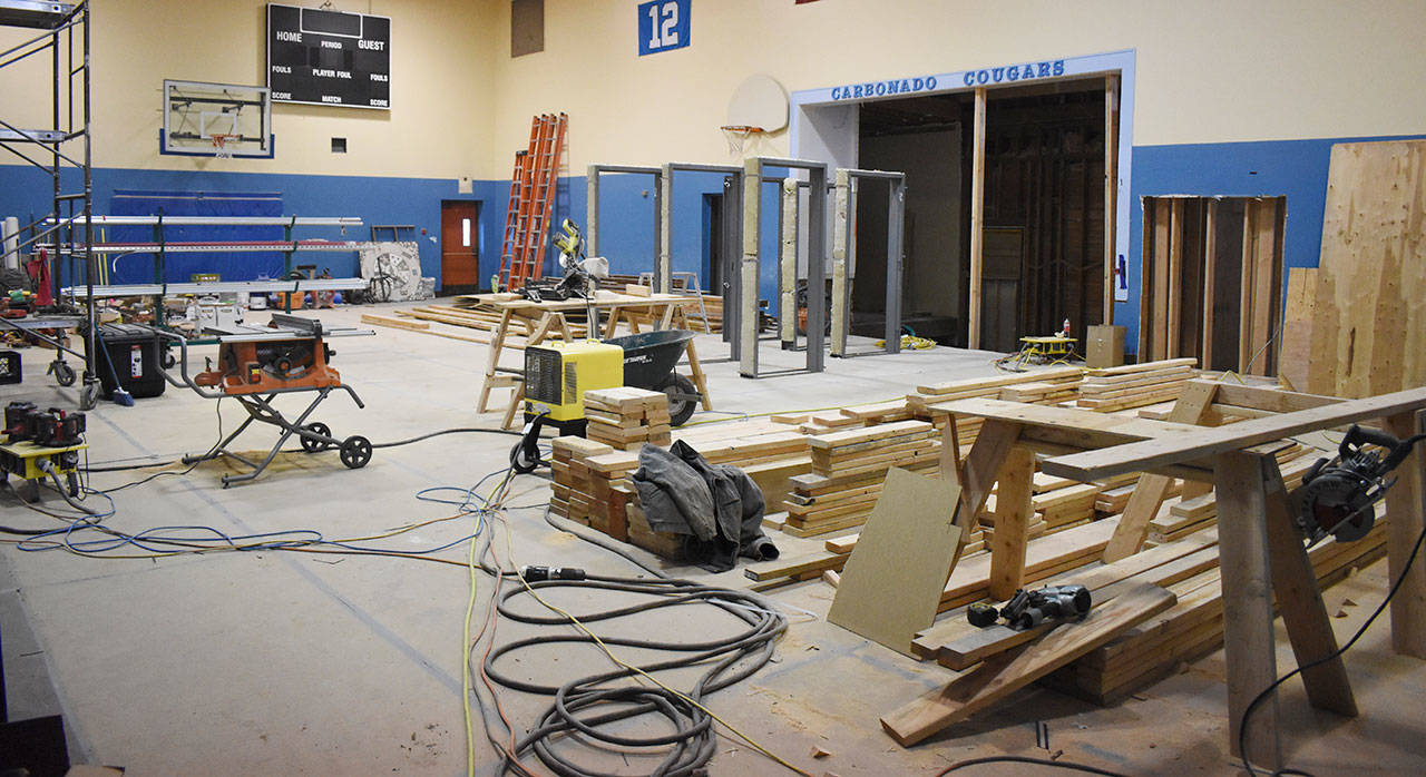 The Carbonado School gym has been turned into a work room during construction at the 90-year-old building. The gym is one of very few rooms that will not be remodeled. Superintendent Scott Hubbard point to an area behind the building where a generator will be installed. Photos by Kevin Hanson
