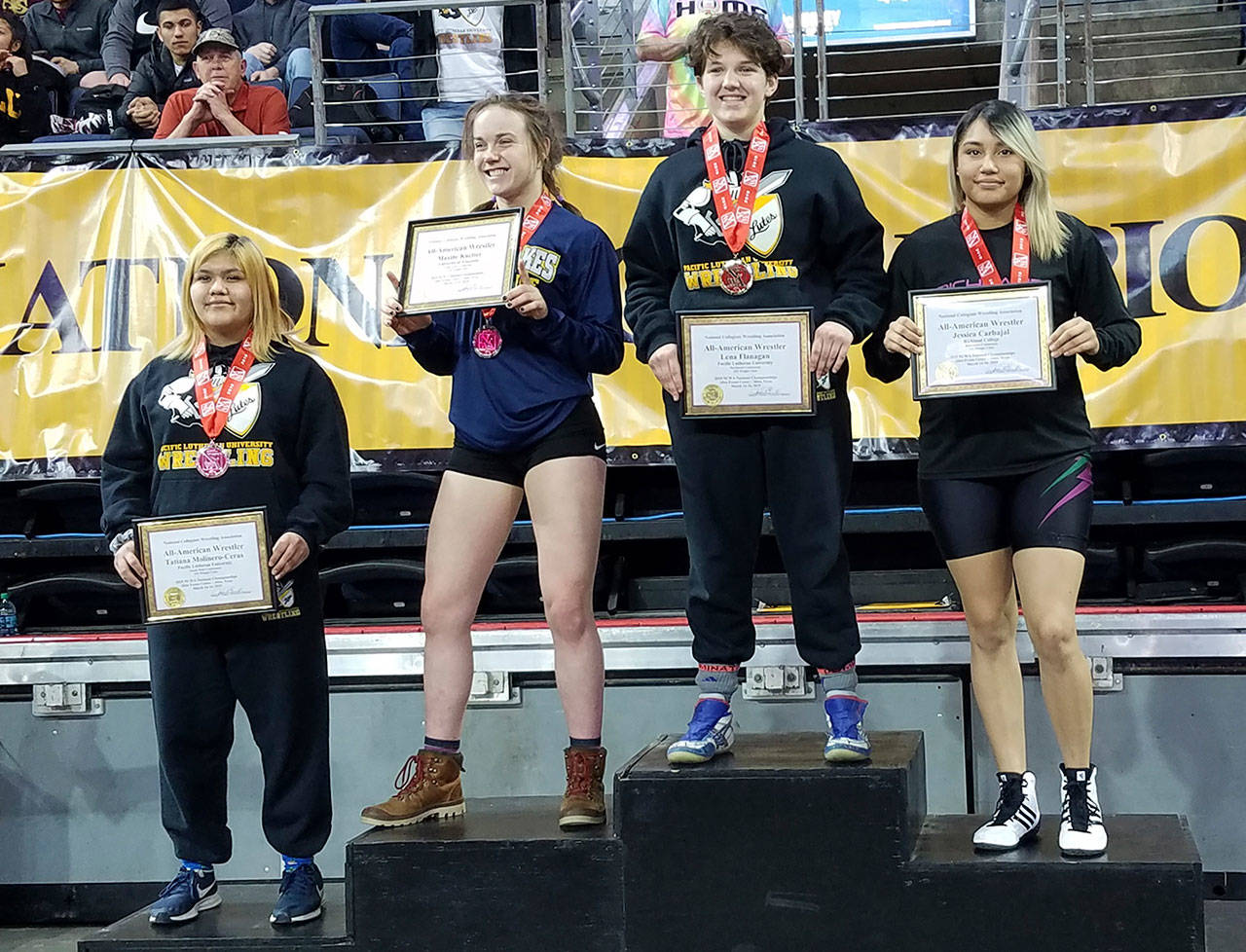 Following an athletic career at White River High, Tatiana Molinero-Ceras headed to Pacific Lutheran University. In her first year of collegiate wrestling, she placed fourth at the NCWA national championships. At left, she stands on the podium in Texas with the top-three placers; each was accorded All-American status. Submitted photo
