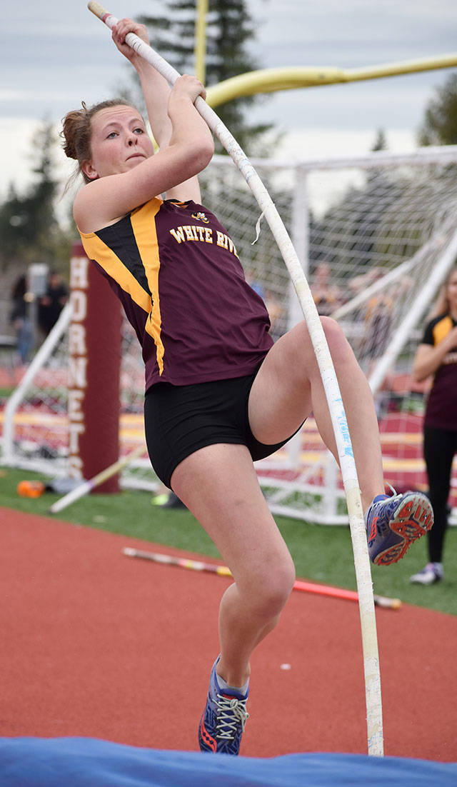 White River’s Jessica Taylor won the pole vault Thursday to help the Hornets defeat the visiting Orting Cardinals. Photo by Kevin Hanson