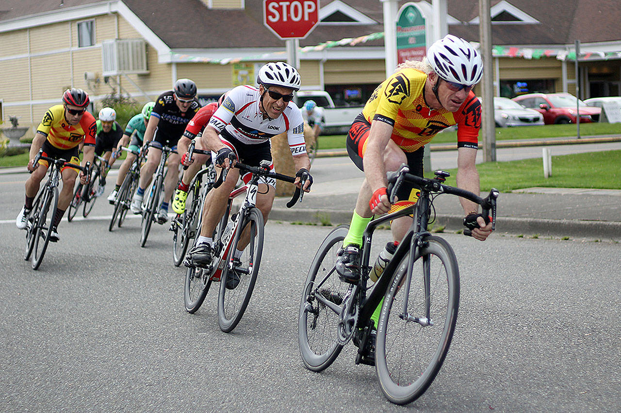 Cyclists make the turn from Griffin Avenue onto Kasey Kahne Drive during last year’s criterium, one element of the annual State Race. File photo by Ray Still.