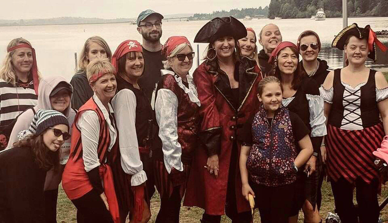 Tricia Foerster, in the large pirate hat, with her crew at the 2018 Seattle MG Walk. The 2019 event will be held at Seward Park in Seattle on Sunday, Sept. 29, with check-in beginning at 9 a.m. Also pictured is Heather Invie, owner of The Garage, on the far left with a red bandana and striped shirt. Submitted photo
