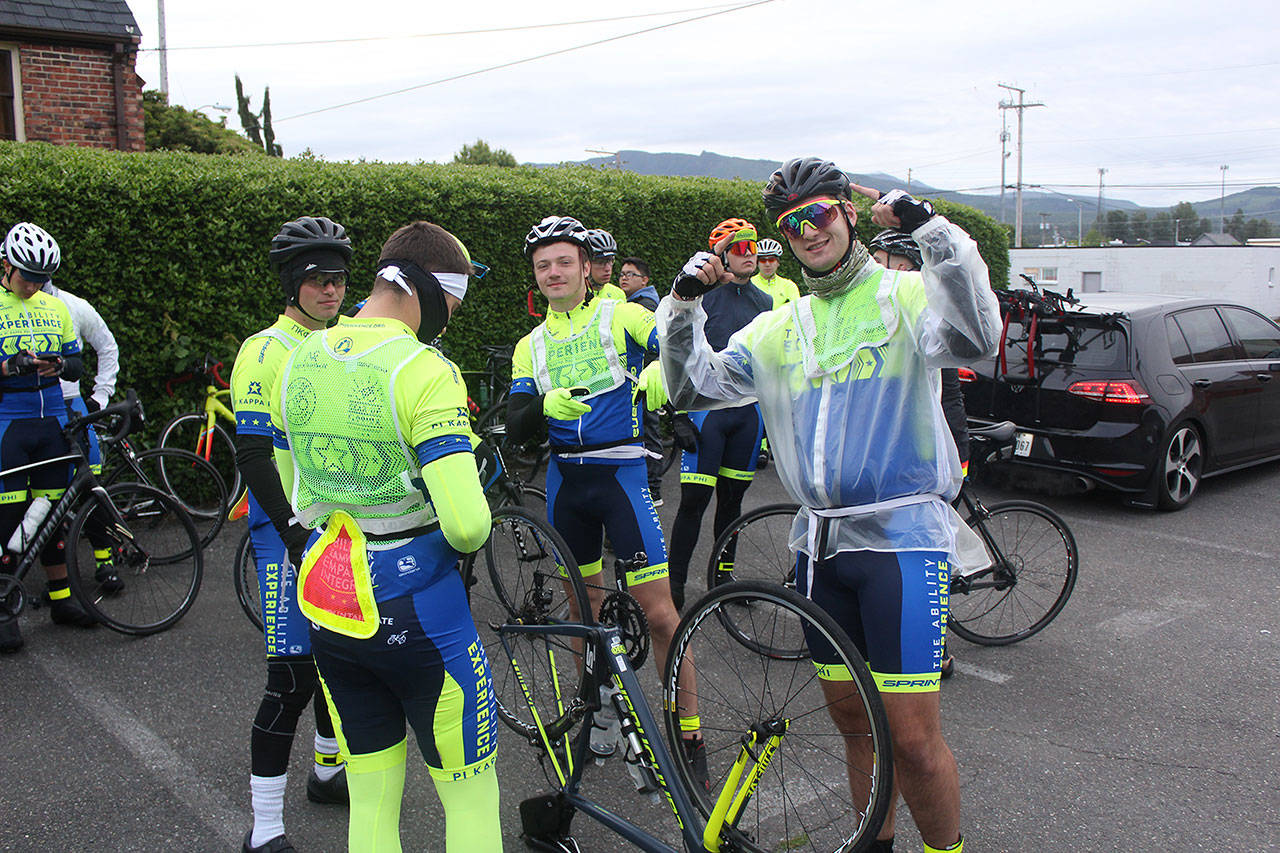 The Journey of Hope TransAmerica team get their final affairs in order behind Enumclaw’s Calvary Presbyterian Church at 6 in the morning before tackling Mount Rainier and a 125 mile ride to Yakima. Photo by Ray Miller-Still
