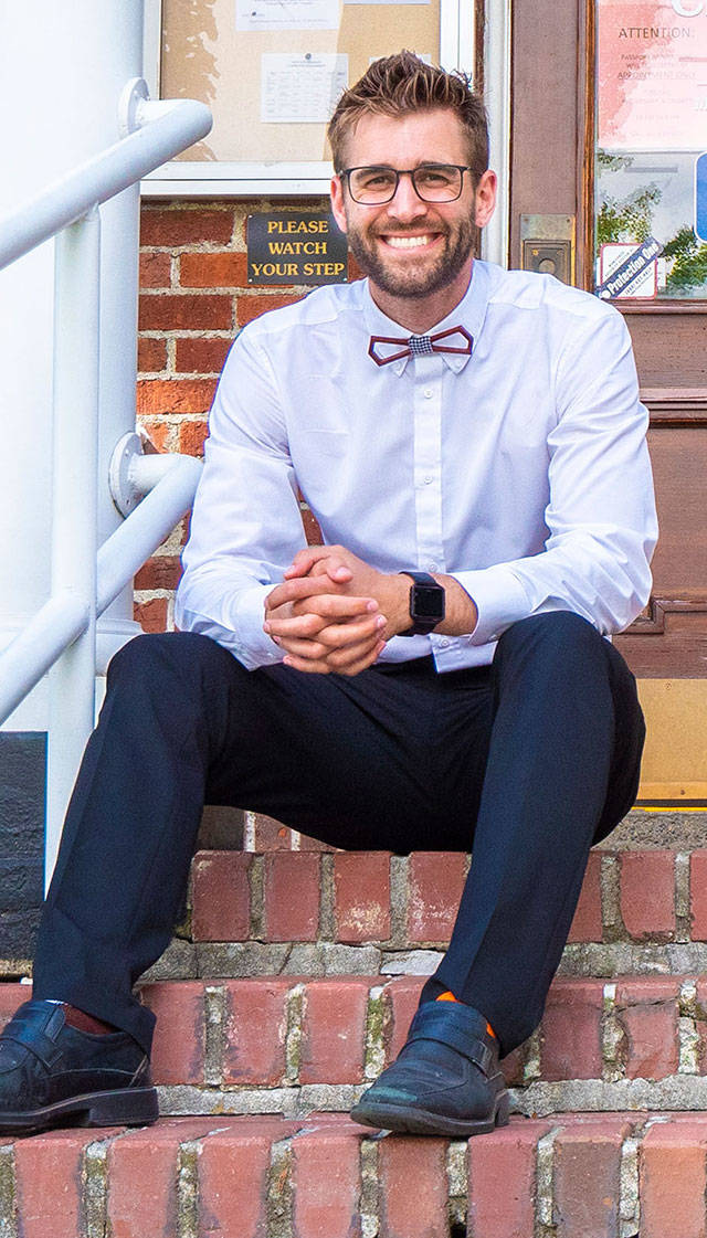 Beau Chevassus, sitting on the Enumclaw City Hall steps, will officially join the City Council following a June 24 swearing-in ceremony. Submitted photo