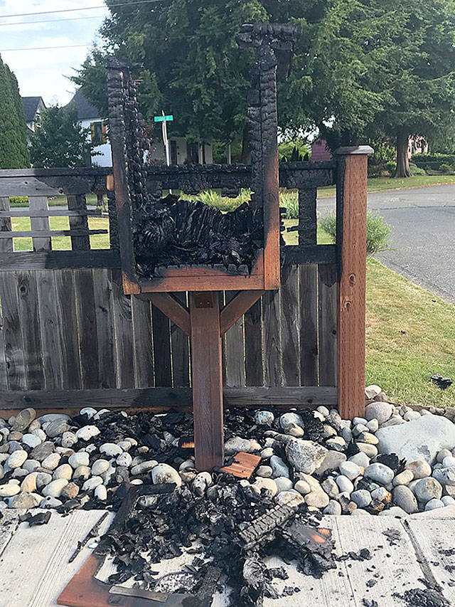 The fire that burnt down the Little Free Library on Marion Street also damaged the fence behind it. Photo courtesy Amy Penasa