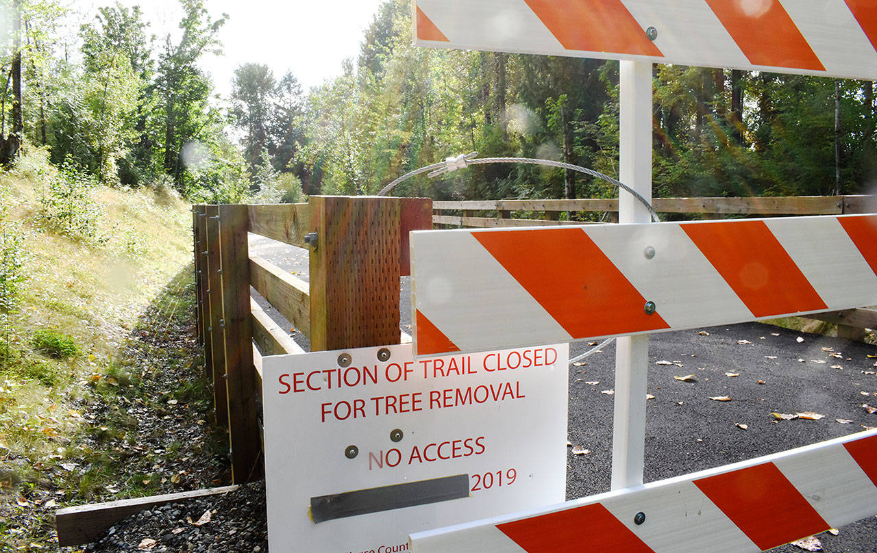 Pierce County has installed barricades at each end of the pin-pile bridge, hoping to keep Foothills Trail users away from a damaged section. Photo by Kevin Hanson