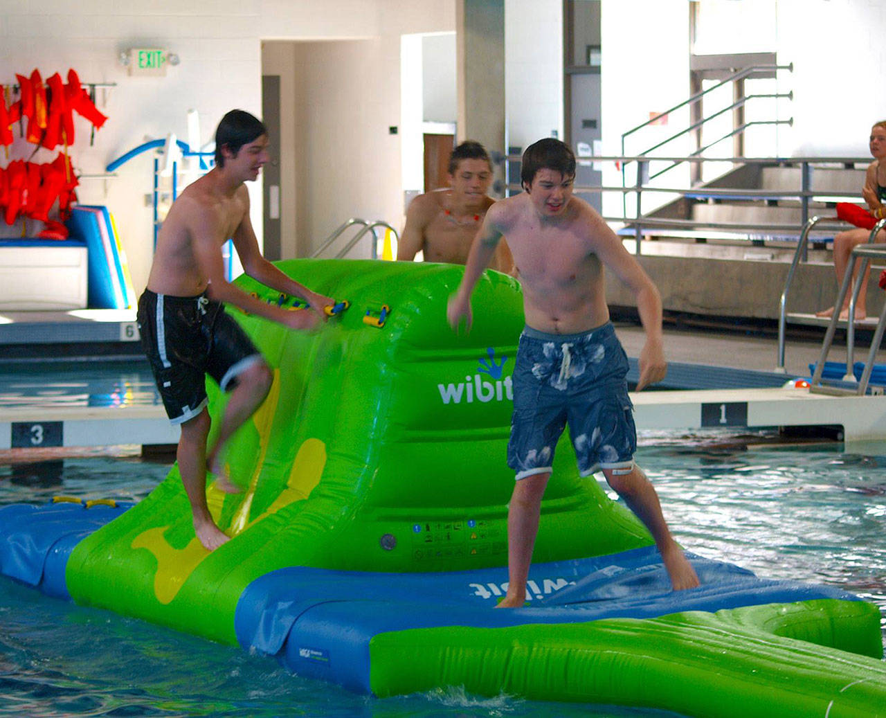 Teenagers at the Enumclaw pool enjoying WIBIT Night in February; WIBIT is a company that makes unique water inflatables, like obstacle courses, climbing walls, battle arenas, and more. Photo courtesy Enumclaw Aquatic Center