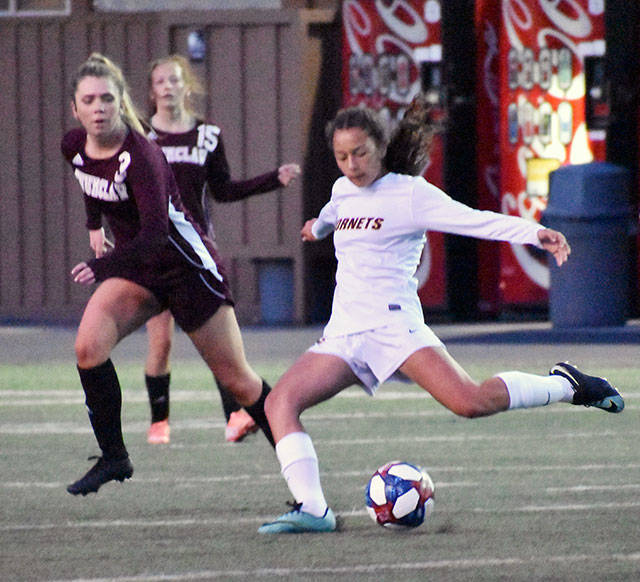 White Rivers Morgan Greene tries to get the ball away from her EHS opponents and further up the field. Photo by Kevin Hanson