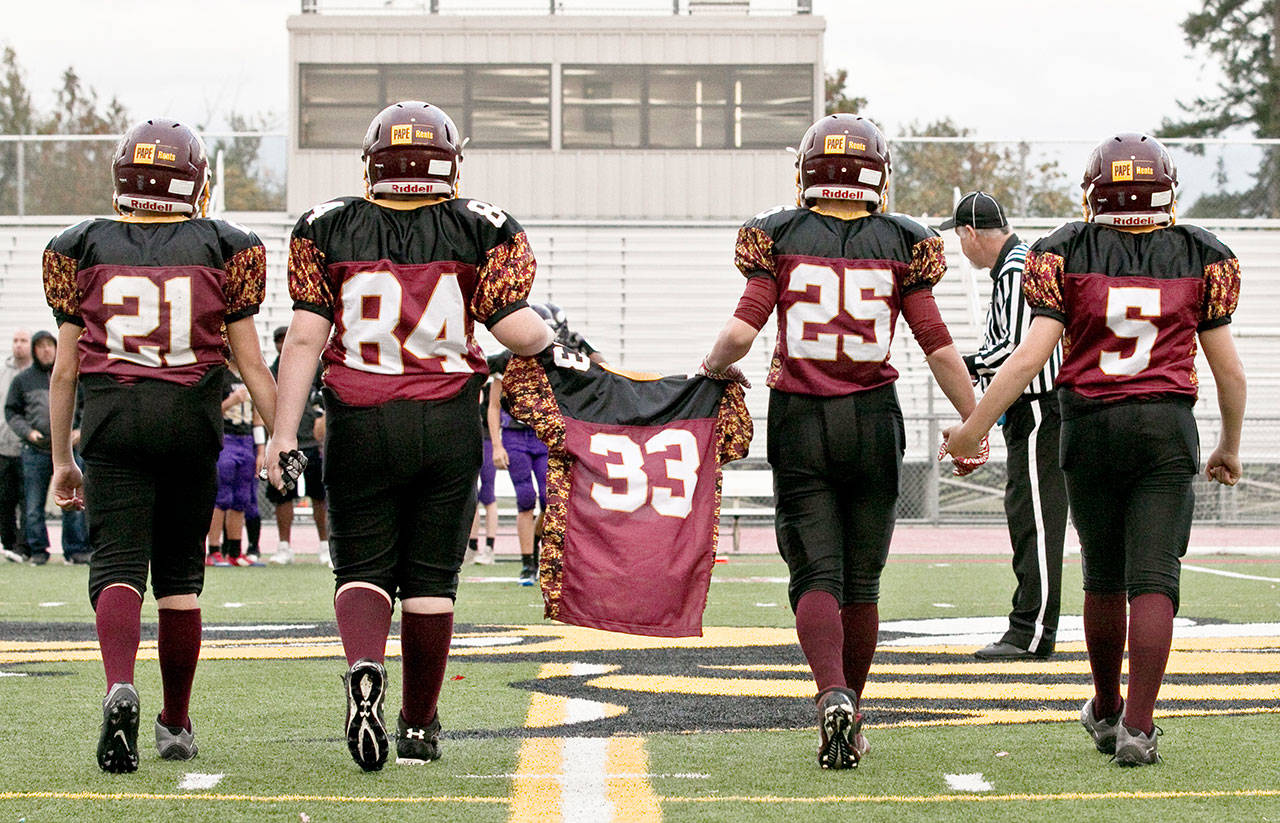 As part of Davis Day 2018, players carry the No. 33 jersey in honor of Jordan Davis, making him an honorary captain during one of the day’s football games. Doing the honors are, from left: Ryan Buffington, Reice Branch, Evan Weimer and Kaelon Van Hoof. Photo courtesy Joanne Campbell