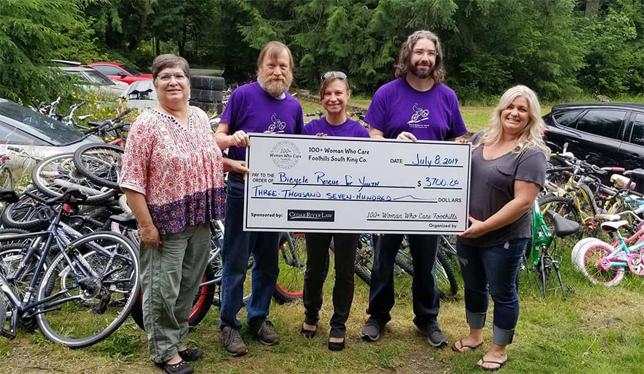 The South King County’s 100+ Women Who Care group presented Bicycle Rescue for Youth, a Ravensdale-based group, $3,800 at their last meeting. Pictures is Valerie Westover at the left, Bicycle Rescue board member Toni Culberson in the middle, and Nikki Westover at the right. Submitted photo