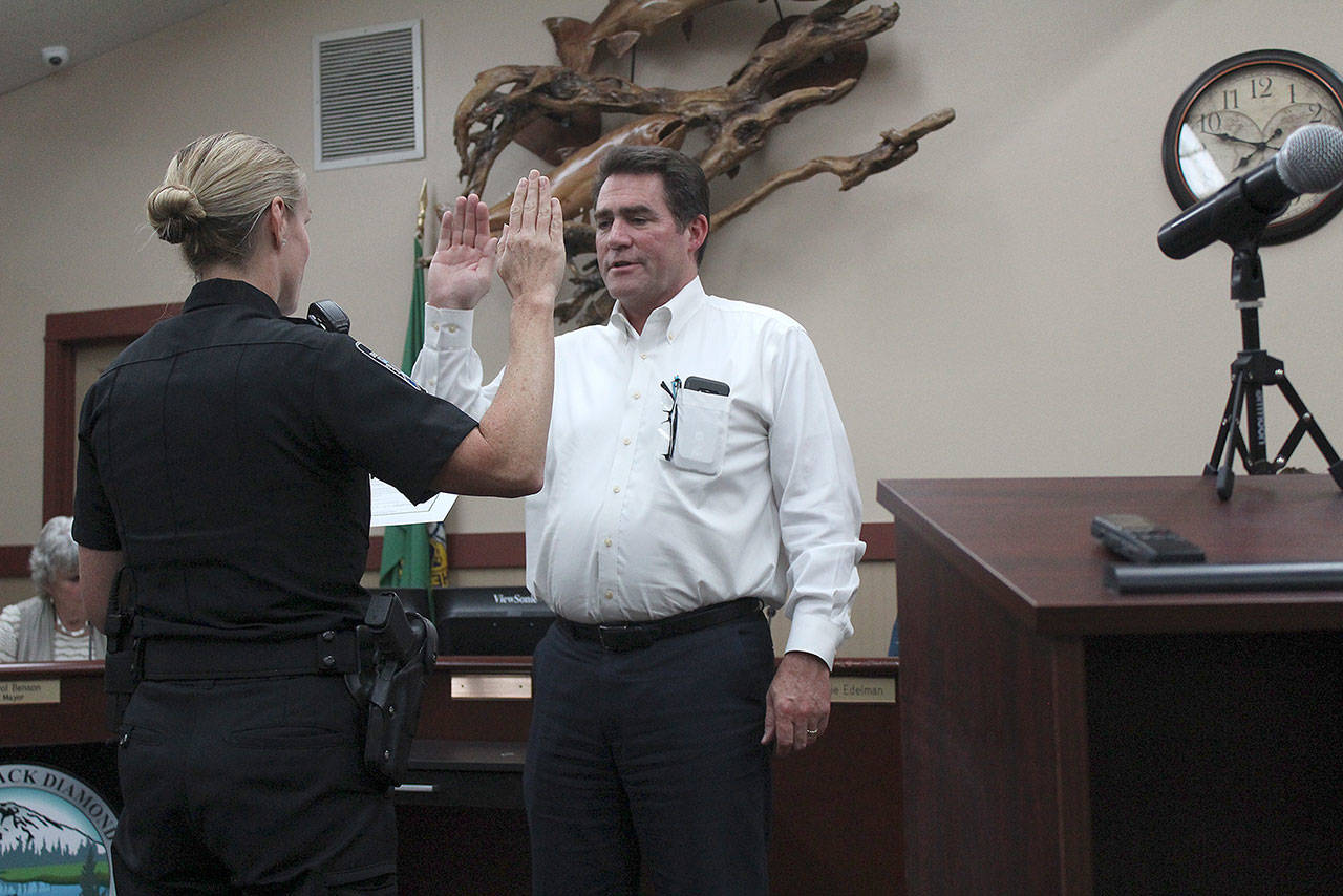 Black Diamond Police Chief Jamey Kiblinger swore in new Councilman Steven Paige during the Sept. 19 council meeting. Photo by Ray Miller-Still
