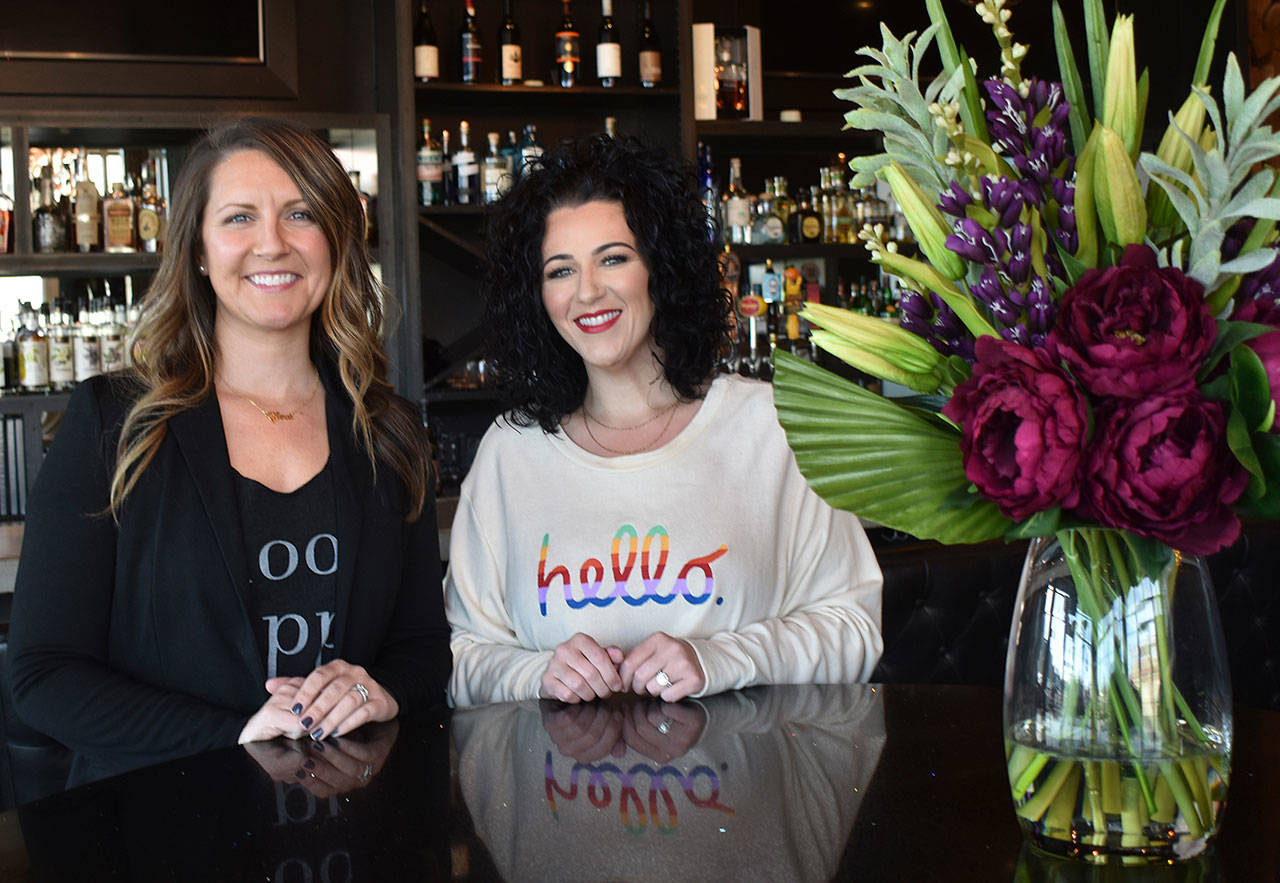 Leading the way at Glow Martini Lounge are sisters-friends-business partners Randi Baker (left) and Kendra Harrington. Photo by Kevin Hanson