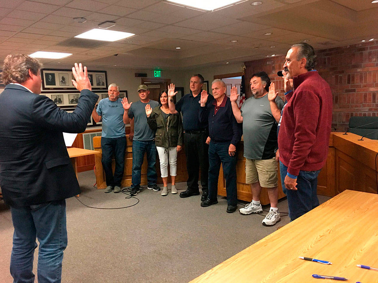 In July 2019, King County Council member Reagan Dunn swore in new Commissioners from Drainage Districts 5, 6 and 13. Left to right, Reagan Dunn, John Koopman, Kenny Bosnik, Cathy Dahlquist, Alan Predmore, Jim Puttman, John Millarich, Mark Van Wiernigan, and David Ballestrasse. Contributed by David Shurtleff