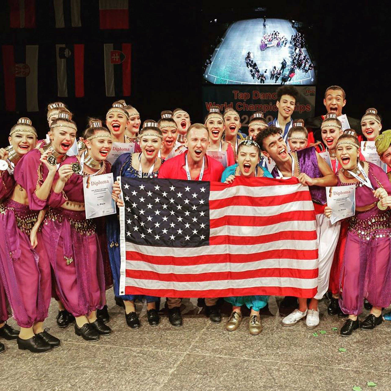 Zachary Kelley, a former Buckley resident who started tap dancing when he was 6 years old, recently took the gold in the World Tap Dancing Competition in Germany last month. Kelley is pictured center in red. Photo courtesy American Tap Company