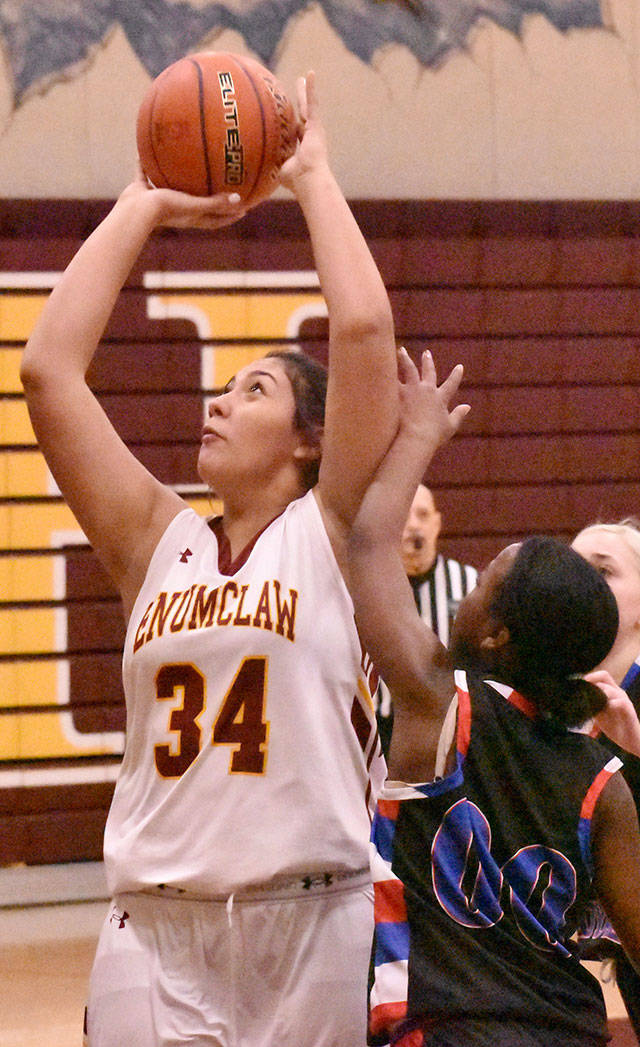 Marissa Espinosa works under the basket during Enumclaw’s easy victory of Kent-Meridian. Photo by Kevin Hanson
