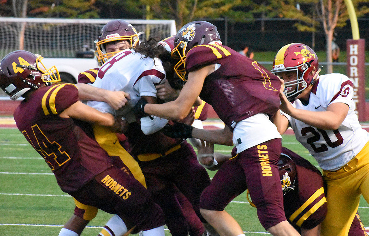 A bill addressing concussions among high school athletes has been introduced by Rep. Morgan Irwin of Enumclaw. At the heart of the legislation is the health of young athletes like these Enumclaw and White River football players. They squared off during the fall in the annual Battle of the Bridge. Photo by Kevin Hanson