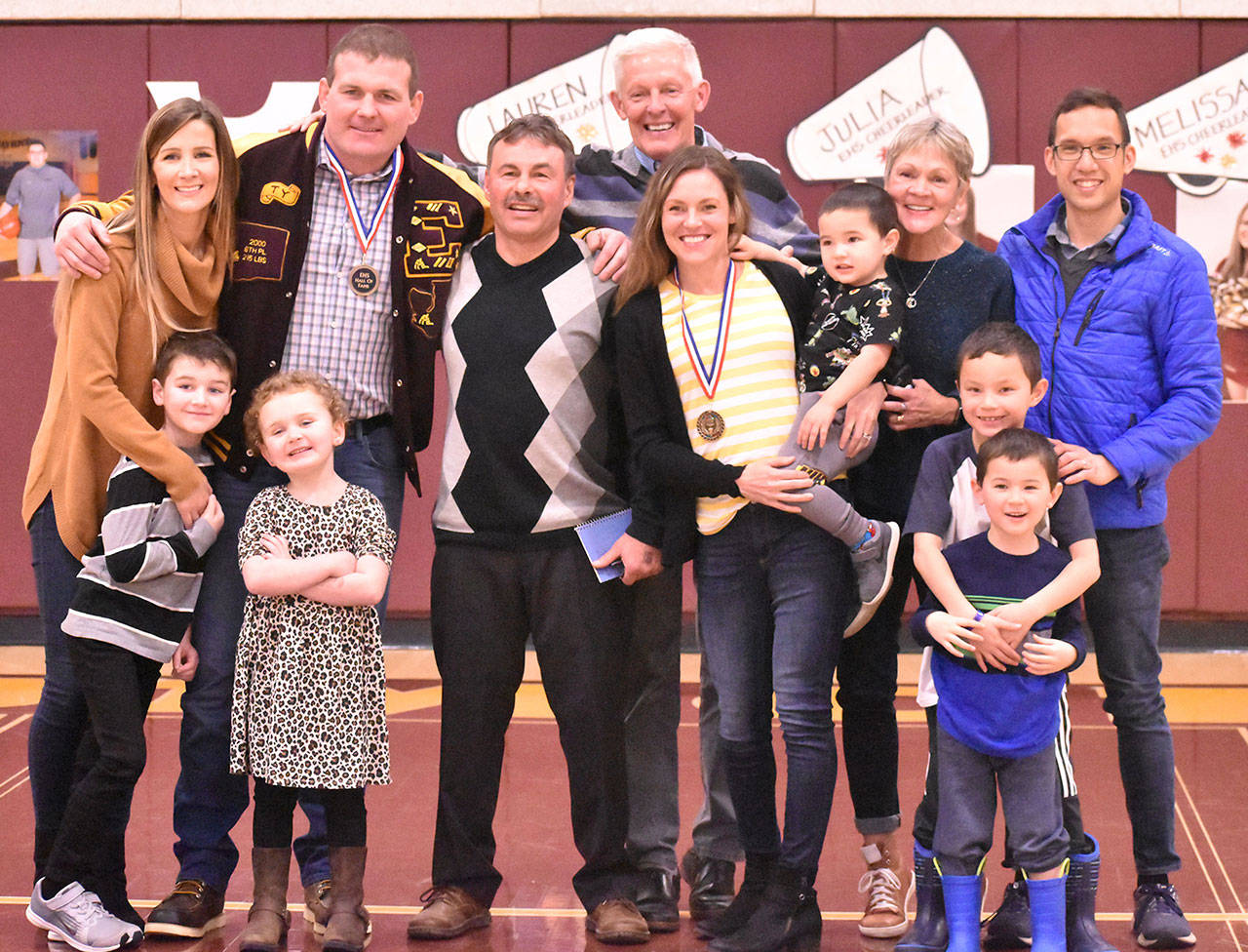 Gathering for a group photo Friday were Ty Watterson, his wife Megan, kids Sam and Macy, and his EHS coach Lee Reichert. Joining Alison Tubbs Mandi were her husband Mark, children Nathan, Tyler and Zach, and her parents Tim and Nancy. Photo by Kevin Hanson