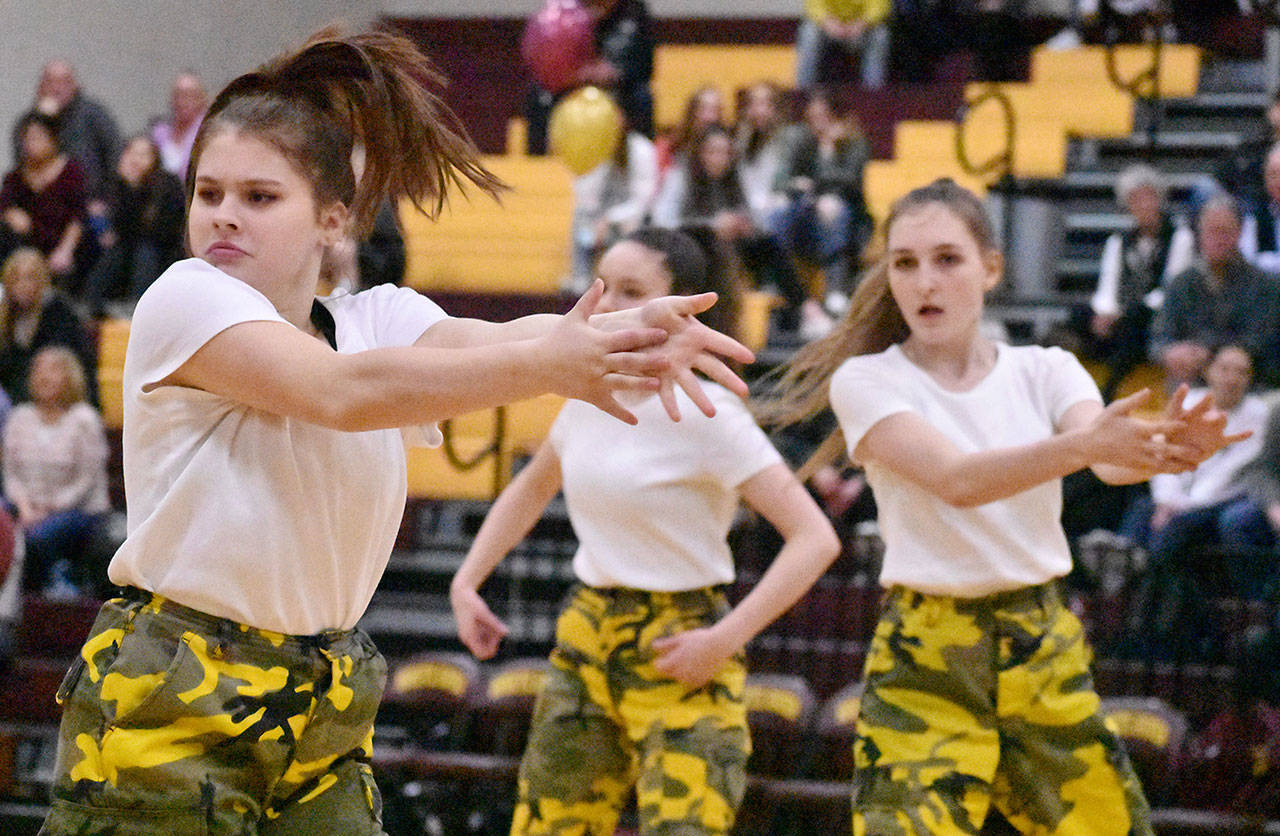 White River High’s dance team performed during halftime of Friday night’s basketball game in the Hornet gymnasium. From left, Amelia Oliver, Marissa Carpenter, and Allison Slaght. Photo by Kevin Hanson