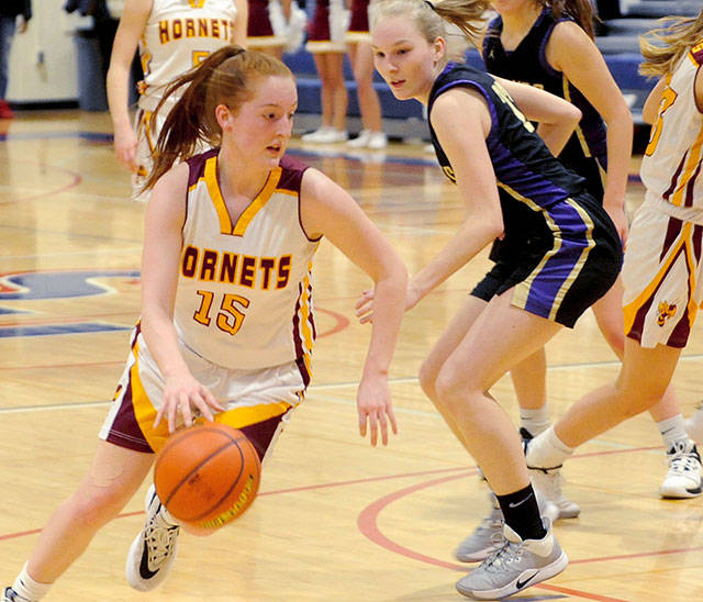 Kara Marecle drives to the hoop during a Feb. 22 victory against the Sequim Wolves. Photo by Kevin Hanson