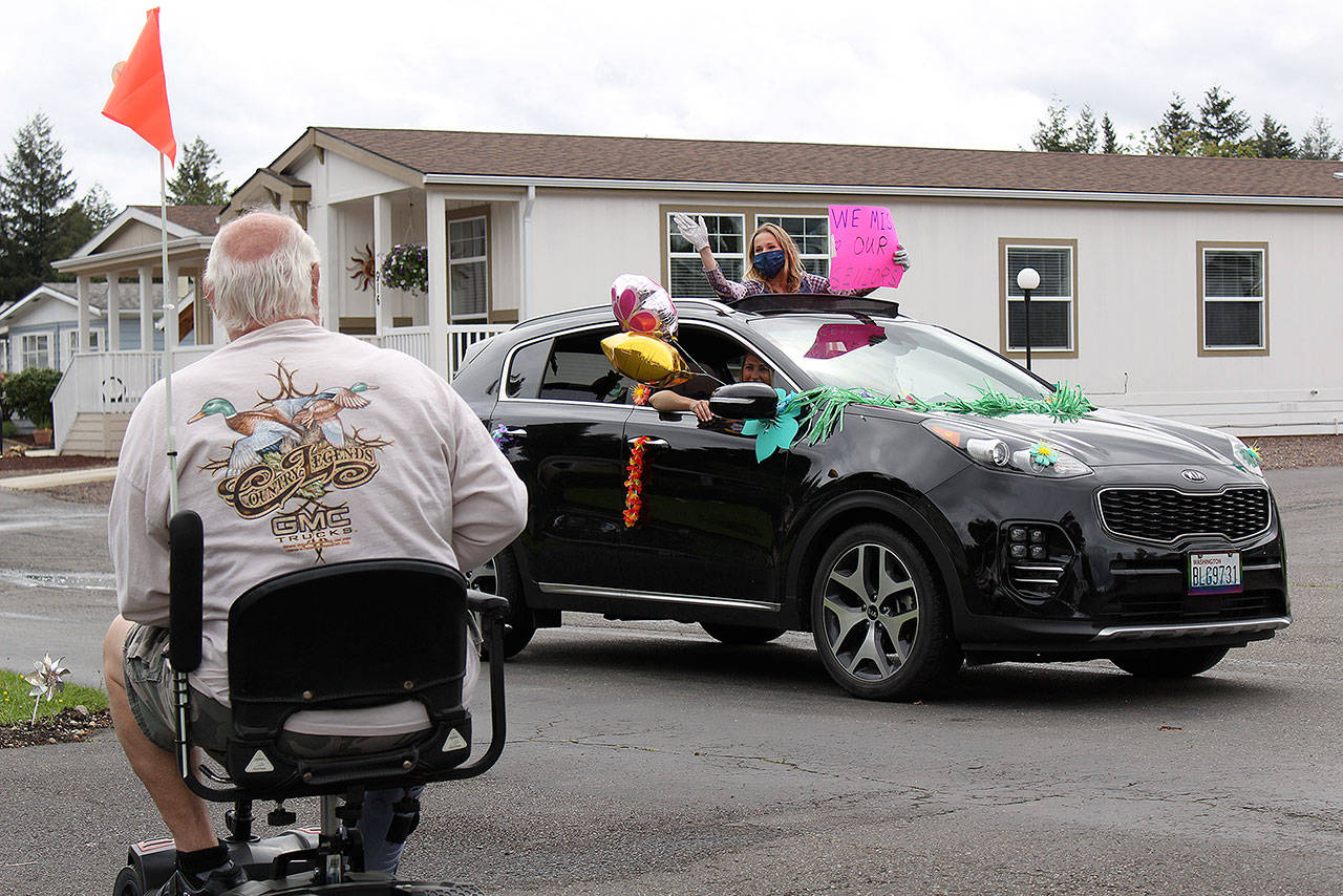The Enumclaw Senior Center paraded around Enumclaw on May 14 to say “hi” to seniors stuck at home due to the coronavirus. Photo by Ray Miller-Still